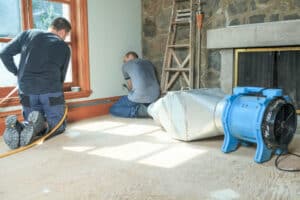 professionals cleaning air ventilation in a home