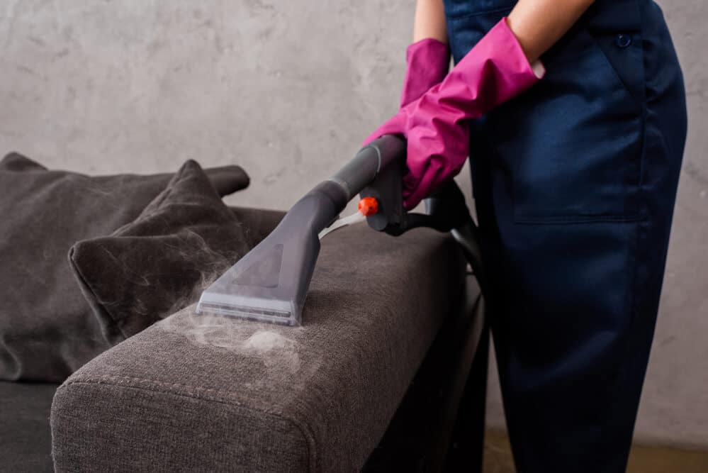 Pressure washing a paved residential surface
