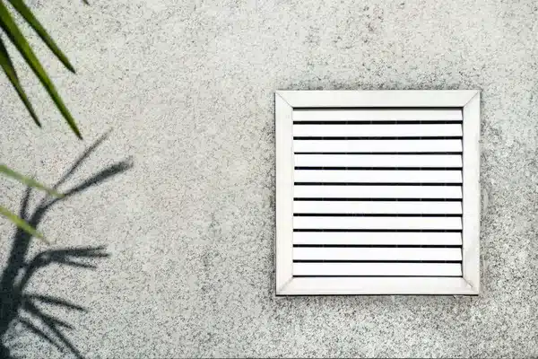 Aged vent with white shutters