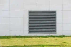 Vent cover on the wall of the house